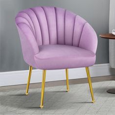 a purple chair sitting on top of a wooden table