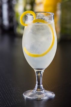 a glass filled with water and lemon slices