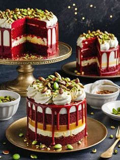 two cakes with red velvet frosting and topped with pistachios on plates