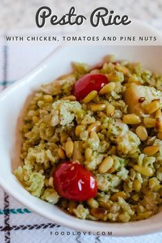 a white bowl filled with food on top of a checkered table cloth and text overlay reads pesto rice with chicken, tomatoes and pine nuts