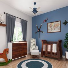 a baby's room with blue walls and wooden furniture