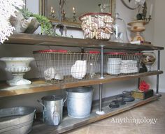 some baskets are sitting on top of a shelf