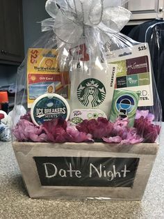 a starbucks gift basket with coffee, cookies and flowers in it that says date night