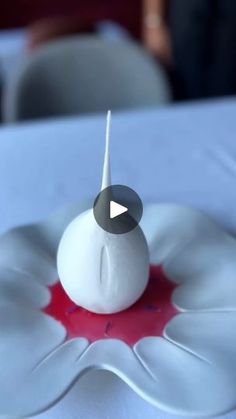 a white cake sitting on top of a table