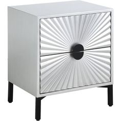 a white and black cabinet with an abstract design on the front, one drawer open