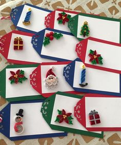 christmas themed place cards are laid out on a table