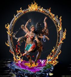 an artistic photo of two women dancing in front of a fire frame with flames around them