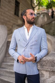 Elevate your style with the HolloMen Piazza Double-Breasted Blue Jacket. This sophisticated jacket is crafted with precision and attention to detail, perfect for adding a touch of timeless elegance to your wardrobe.