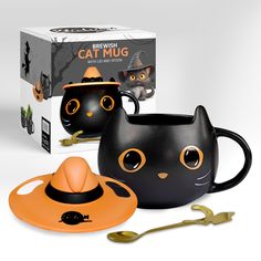 two black cat mugs with halloween decorations on them