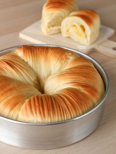 a pastry in a metal pan on a wooden table