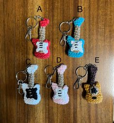 four crocheted keychains with different designs on them