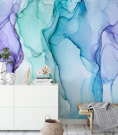 an artistic wallpaper with blue, purple and white swirls on the walls in a living room