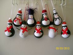 snowmen are hanging from hooks on the wall