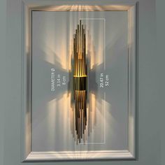 an art piece is shown in a frame with the light reflecting off it's side