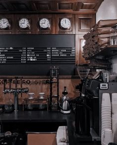 a coffee shop with clocks on the wall