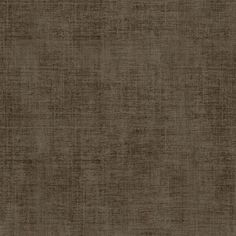 a dark brown fabric textured up to the top of a wallpapered surface