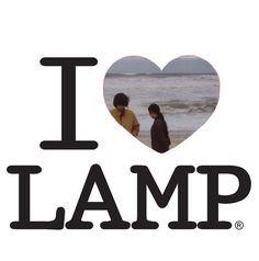 i love lamp with two people standing on the beach