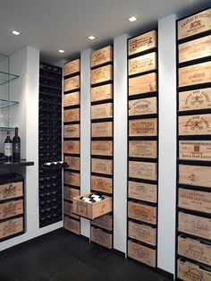 a wine cellar with many wooden boxes on the wall