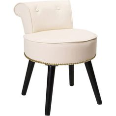 an upholstered white chair with black legs and gold studded trimmings