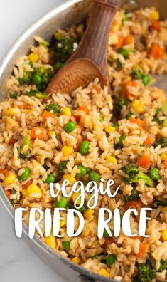 vegetable fried rice in a pan with a wooden spoon on the side and text overlay