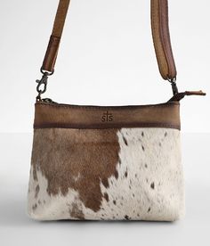 STS Grace Crossbody Purse - Cream/Brown , Women's Cowhide Distressed leather and fur fabric lined purse You are enough. interior graphic Zipper closure Removable strap Dimensions: 8(L) x 2(W) x 6 1/2(H) Due to the natural cowhide there will be a color/pattern variance with each piece. Due to the nature of leather/suede, small variances of color in the skin may occur, this is in no way considered a defect. These are inherent characteristics of leather/suede and will enhance the individual look of Western Crossbody Purse, Hand Bags Ideas, Purse With Fringe, Vegan Design, Cowhide Purse, Fringe Crossbody Bag, Western Purses, Rodeo Outfits, Bags Ideas