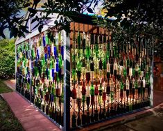 a fence made out of wine bottles is shown