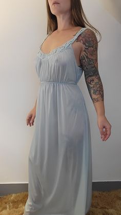 Gorgeous pale blue slip gown Vanity Fair Size Large  Slippery Nylon fabric Looks and feels great Nice vintage condition  See photos for details  Questions welcome  Please note that all sales are final  Measures approximately  Pit to pit 42 inches Model measures 35B 28W 39H for reference Blue Short Sleeve Nightgown, Sleep Night Gown Light Blue, Cheap Blue Spring Nightgown, Summer Blue Nightgown, 2xl-nylon Slip Dress, Cheap Blue Nightgown For Spring, Sleep Gown Light Blue, Cheap Blue Nightgown For Summer, Casual Blue Cheap Nightgown