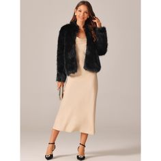 This trendy piece features long sleeves, a mock neck, slant pockets, and an open front design. The shaggy coat with its solid color and cropped length is a versatile outwear option. Seta T Women's Shaggy Warm Jacket is a must-have for any fashion-forward individual. This cropped, long-sleeved coat is a staple in women’s wardrobes, providing both warmth and style. It can be effortlessly paired with pants for a cozy and casual look, while also adding a fashionable touch when styled with a long dre Warm Winter Jacket, Black Faux Fur Jacket, Short Faux Fur Jacket, Winter Overcoat, Faux Fur Cropped Jacket, Womens Faux Fur Coat, Long Faux Fur Coat, Fluffy Jacket, Party Models