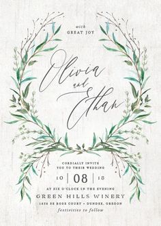 an elegant wedding card with greenery and calligraphy