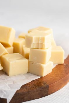 several pieces of butter sitting on top of a wooden cutting board