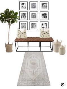 a living room with pictures on the wall and a rug in front of an area rug