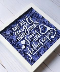 a white frame with blue paper roses and the words, you have always had something to do