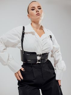 The model is wearing a size XL and is 33.5"/85 cm waist, 35"/89 cm underbust, 41.5"/106 cm bust.Can a belt be addictive to wear? According to our satisfied customer Kailus, the Moonson Belt most definitely can! Crafted with love and precision, this special leather belt can make even old outfits as good as new. Edgy Black Belt Buckle With Removable Belt, Edgy Black Harness With Belt Loops, Elegant Fitted Belts And Suspenders With Matching Belt, Gothic Black Corset Belt With Belt Included, Black Fitted Corset Belt With Belt Included, Black Edgy Corset Belt, Fitted Black Belts And Suspenders For Party, Edgy Black Corset Belt, Fitted Black Belted Corset Belt