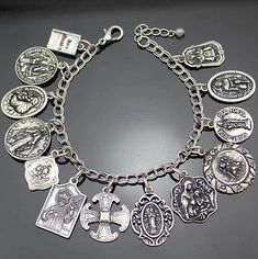 a silver bracelet with many charms on it