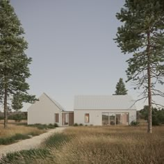 a house in the middle of a field surrounded by tall grass and trees, with a path leading to it