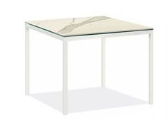 a white table with a marble top and metal legs, viewed from the side on a white background