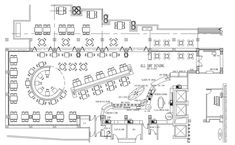 the floor plan for an office with tables and chairs, desks, and seating areas