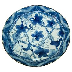 a blue and white plate with flowers on it