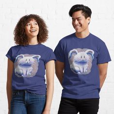 two people standing next to each other wearing t - shirts with an animal on them