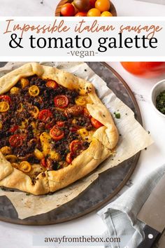 a vegetable and tomato tart on a plate with the title above it that reads, impossible italian sausage & tomato galette vegan