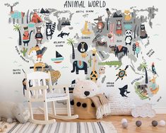 an animal world wall mural in a child's room with rocking chair and toys