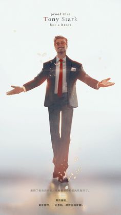 a man in a suit and tie standing with his arms outstretched