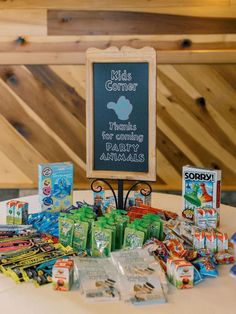 a table topped with lots of candy and snacks