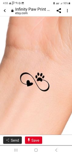 an image of a dog paw tattoo on someone's wrist with the word love written across it