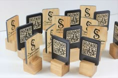 a group of wooden blocks with qr - code designs on the front and sides