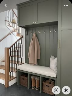 the entryway is decorated in gray and white with wooden steps leading up to it