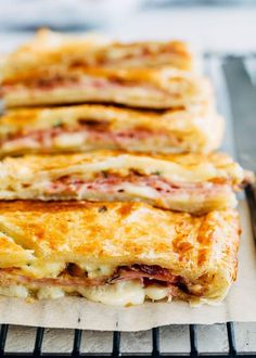 three slices of pizza sitting on top of a cooling rack