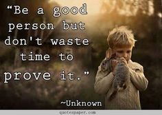 a little boy holding a cat in his hands with the quote be a good person but don't waste time to prove it