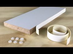 some white tape and buttons on a table