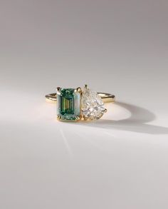 14K Yellow Gold Ring Engagement Ring Green Emerald And Pear Moissanite Ring Two Stone Ring Double Stone Wedding Ring Anniversary Gifts/Ring 𝐓𝐡𝐞 𝐬𝐭𝐨𝐧𝐞𝐬 𝐢𝐧 𝐣𝐞𝐰𝐞𝐥𝐫𝐲 𝐚𝐫𝐞 𝟏𝟎𝟎% 𝐡𝐚𝐧𝐝-𝐜𝐫𝐚𝐟𝐭𝐞𝐝 𝐢𝐭 𝐢𝐬 𝐜𝐮𝐭 𝐚𝐧𝐝 𝐩𝐨𝐥𝐢𝐬𝐡𝐞𝐝 𝐛𝐲 𝐨𝐮𝐫 𝐞𝐱𝐩𝐞𝐫𝐢𝐞𝐧𝐜𝐞𝐝 𝐜𝐫𝐚𝐟𝐭𝐬𝐦𝐚𝐧. 𝐌𝐨𝐢𝐬𝐬𝐚𝐧𝐢𝐭𝐞 𝐢𝐬 𝐚 𝐝𝐢𝐚𝐦𝐨𝐧𝐝'𝐬 𝐛𝐞𝐬𝐭 𝐚𝐥𝐭𝐞𝐫𝐧𝐚𝐭𝐢𝐯𝐞. ✥ 𝐌𝐚𝐢𝐧 𝐒𝐭𝐨𝐧𝐞 𝐃𝐞𝐭𝐚𝐢𝐥𝐬 ↣ Shape: Emerald Cut ↣ Type: Moissanite Diamond ↣ Weight: 1.70 CT (App.) ↣ Dimension: 6x8 MM (App.) ↣ Color: Green Moissanite Diamond ↣ Clarity: VVS ✥ 𝐌𝐚𝐢𝐧 𝐒𝐭𝐨𝐧𝐞 𝐃𝐞𝐭𝐚𝐢𝐥𝐬 ↣ Shape: Pear Cut ↣ Type: Moissanite Diamond ↣ Weight: 1.50 CT (App.) ↣ Dimension: 6x9 MM (App.) ↣ Color: Colorless ↣ Clarity: VVS ✥ 𝐑𝐢𝐧𝐠 𝐃𝐞𝐭𝐚𝐢𝐥𝐬 ↣ Metal Purity: Solid Gol Double Diamond Ring, Two Stone Ring, Stone Wedding Ring, Ring Inspo, Ring Rosegold, Stone Wedding, Promise Ring Gift, Zierlicher Ring, Pear Engagement Ring